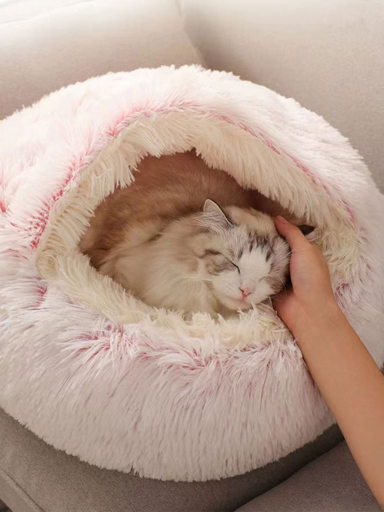 Pink plush round donut pet bed cushion for cats and dogs made from soft polyester fabric.