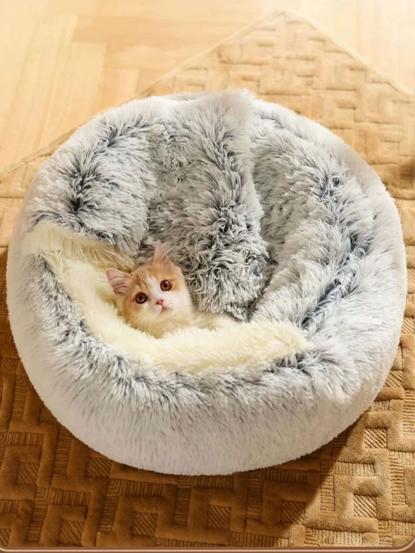 Pink plush round pet bed with a soft 2-in-1 donut sleeping bag cushion design for cats and dogs.