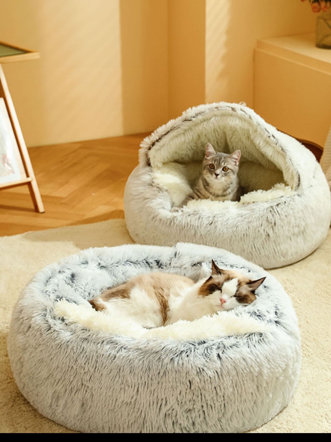 Pink plush round pet bed with a soft 2-in-1 donut sleeping bag cushion design for cats and dogs.