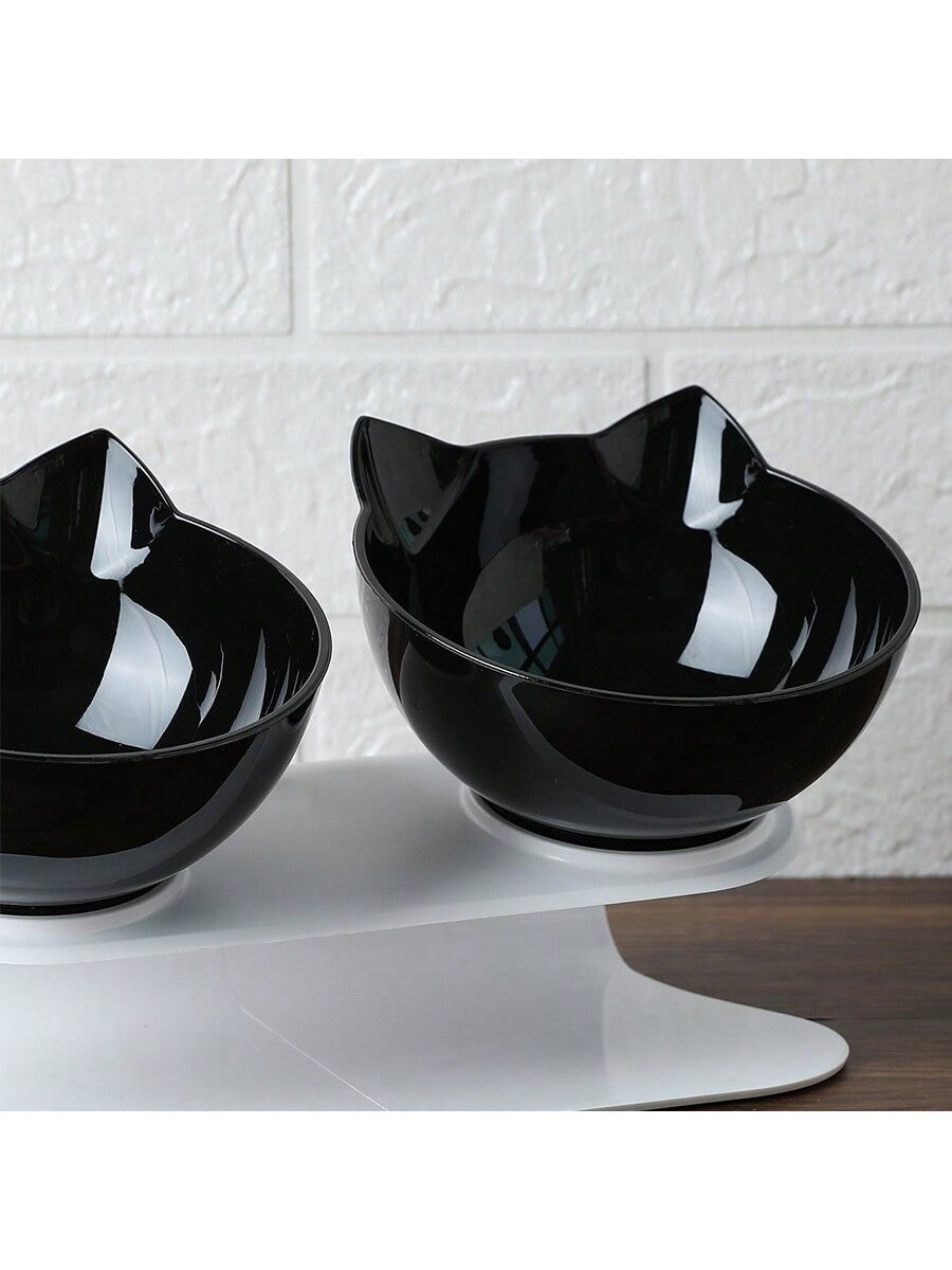 Black cartoon cat design pet bowl set with two PS plastic bowls fitted into a matching base for cats and dogs.