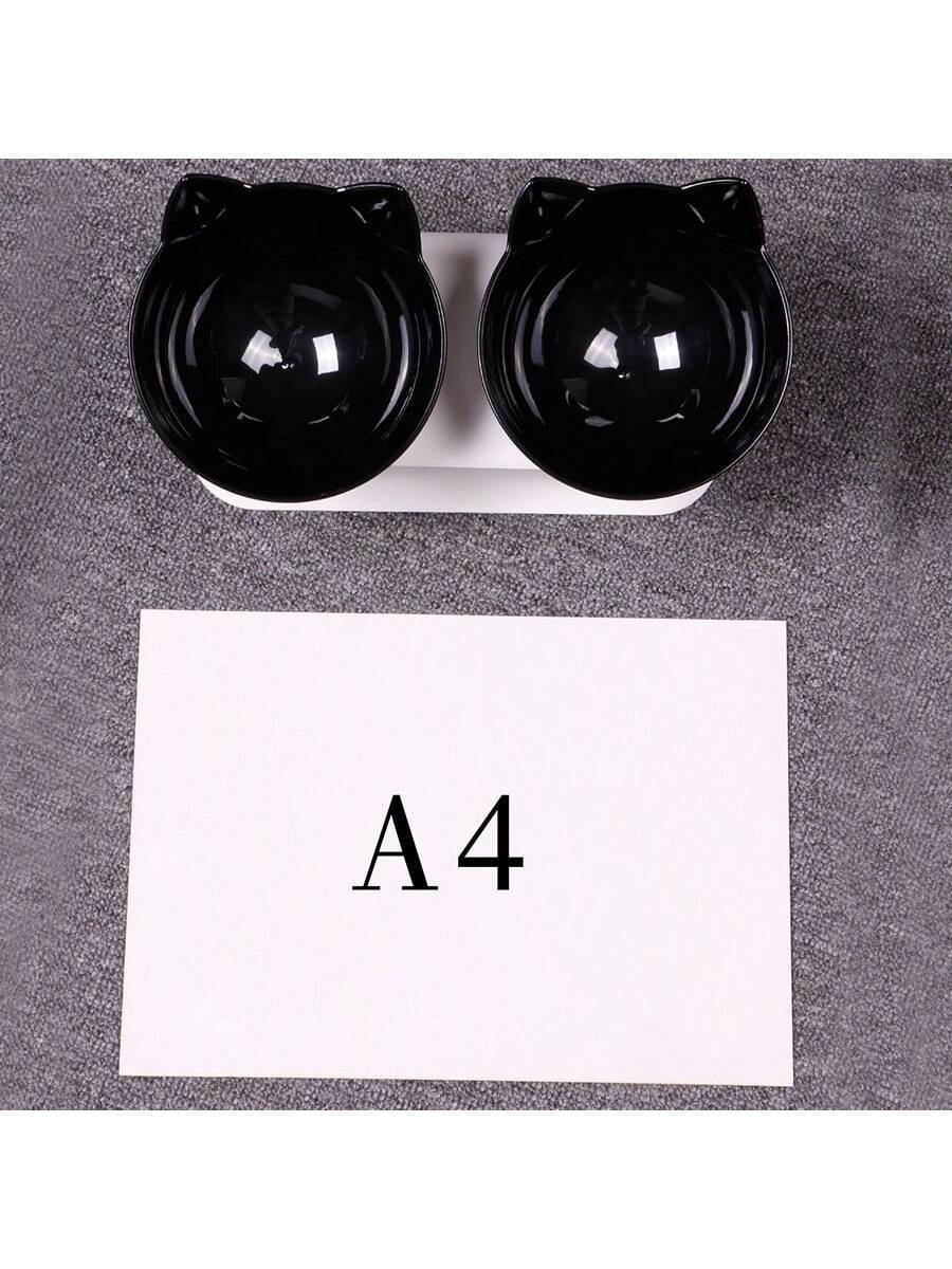 Black cartoon cat design pet bowl set with two PS plastic bowls fitted into a matching base for cats and dogs.