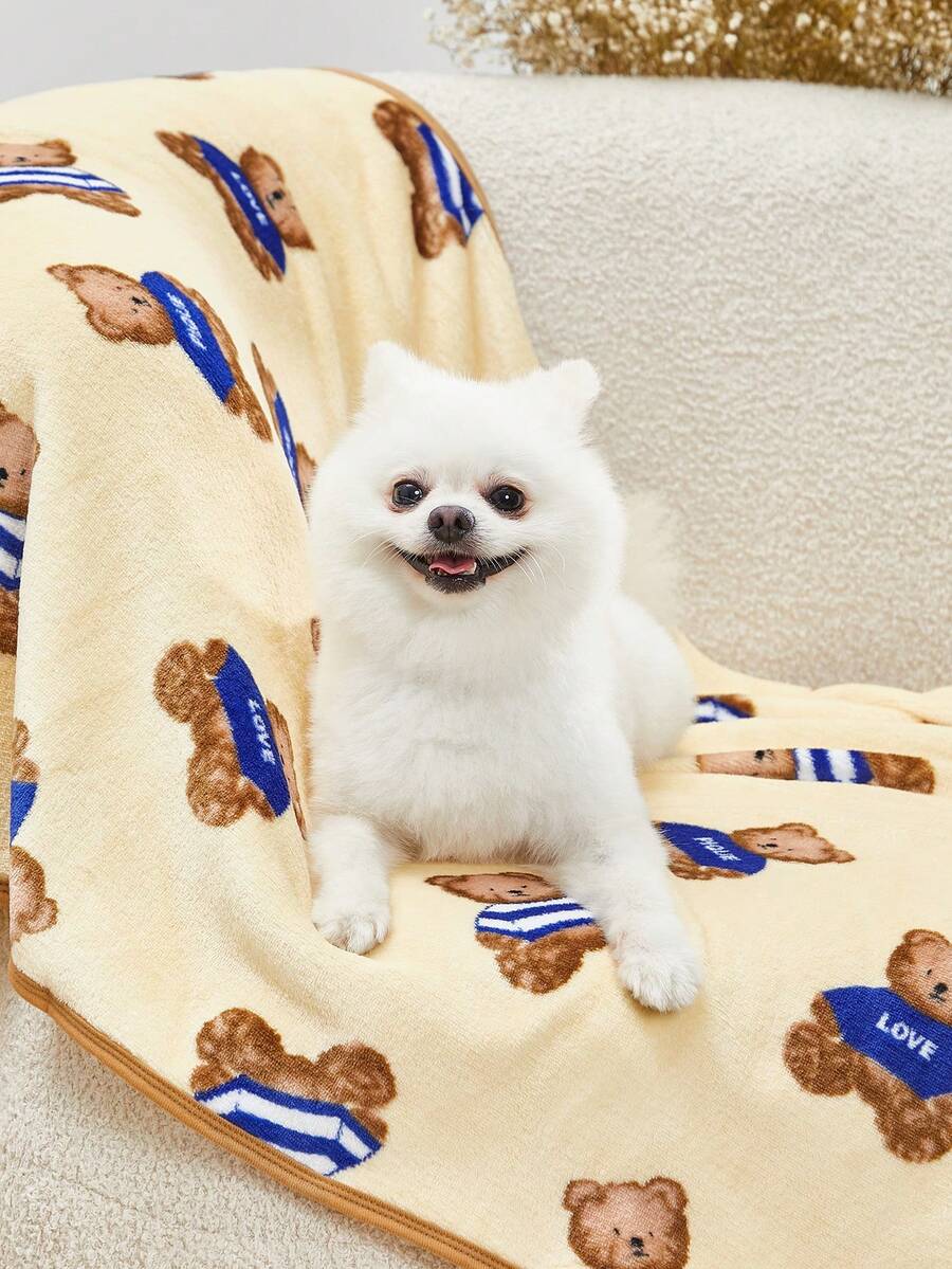 Warm pet blanket with a cute cartoon bear print in multicolor, made of 100% polyester fabric for cats and dogs.