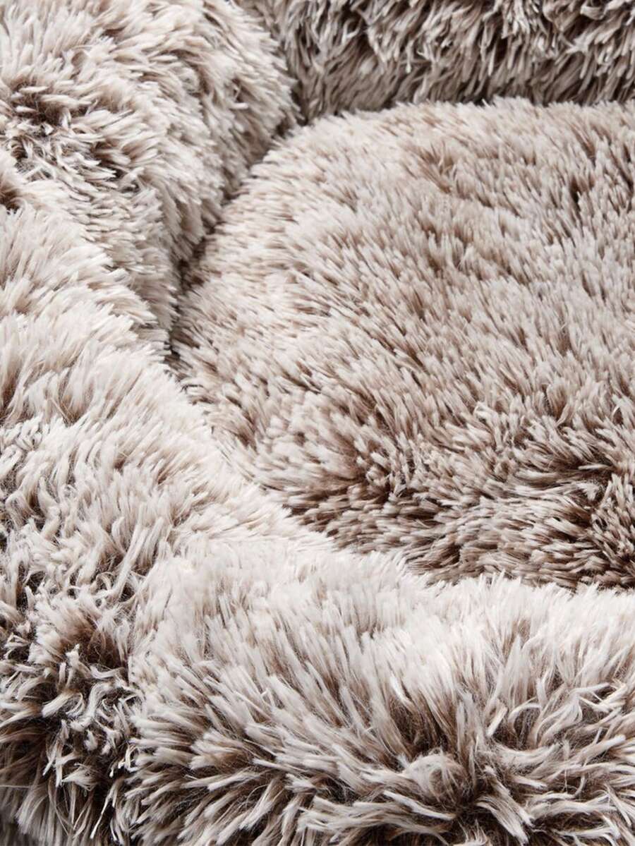Mocha Brown plush round pet bed with non-slip bottom for dogs and cats.
