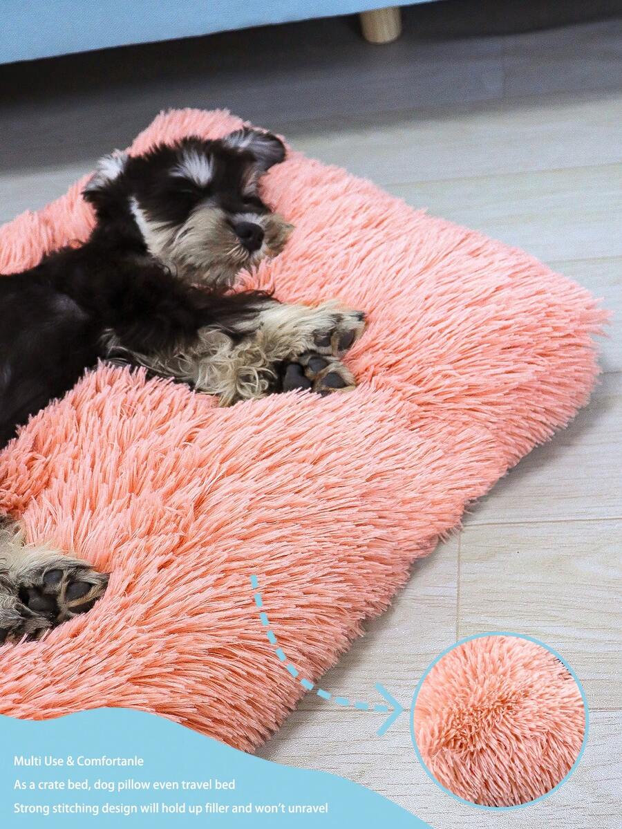 Washable dusty pink plush pet cage bed mat with cartoon pattern for dogs and cats featuring an anti-slip bottom.