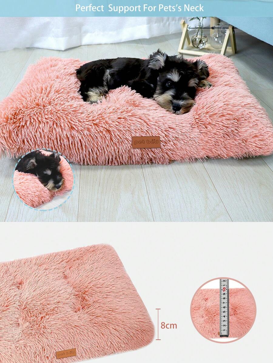 Washable dusty pink plush pet cage bed mat with cartoon pattern for dogs and cats featuring an anti-slip bottom.