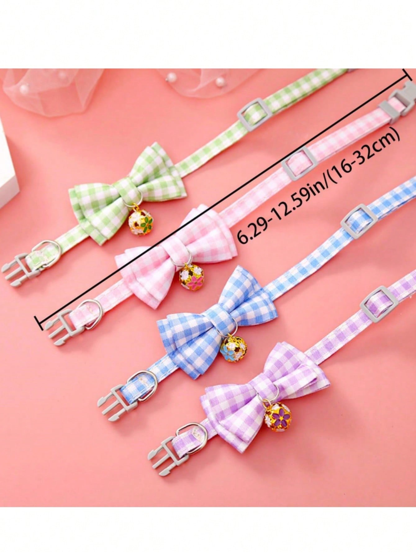 Pink plaid adjustable pet collar with pendant for cats and dogs, made from polyester with plated precious metal detailing.