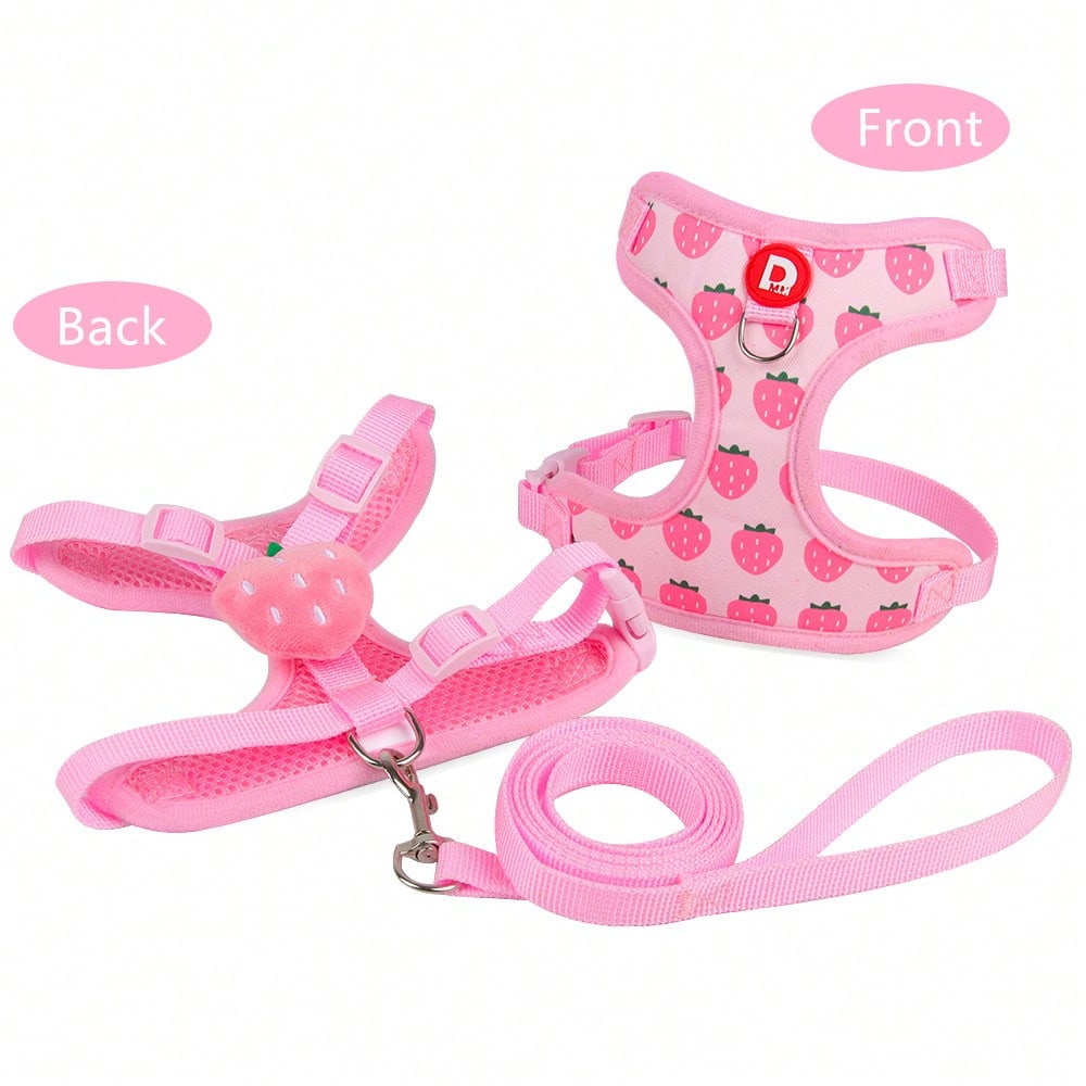 Pink adjustable polyester pet harness and leash set with cartoon pattern for cats and small dogs, designed for outdoor walking.