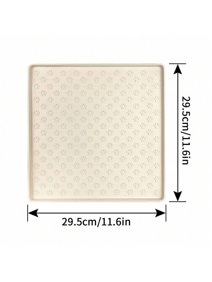 Beige silicone pet placemat with paw detail designed for cat and dog food and water bowls
