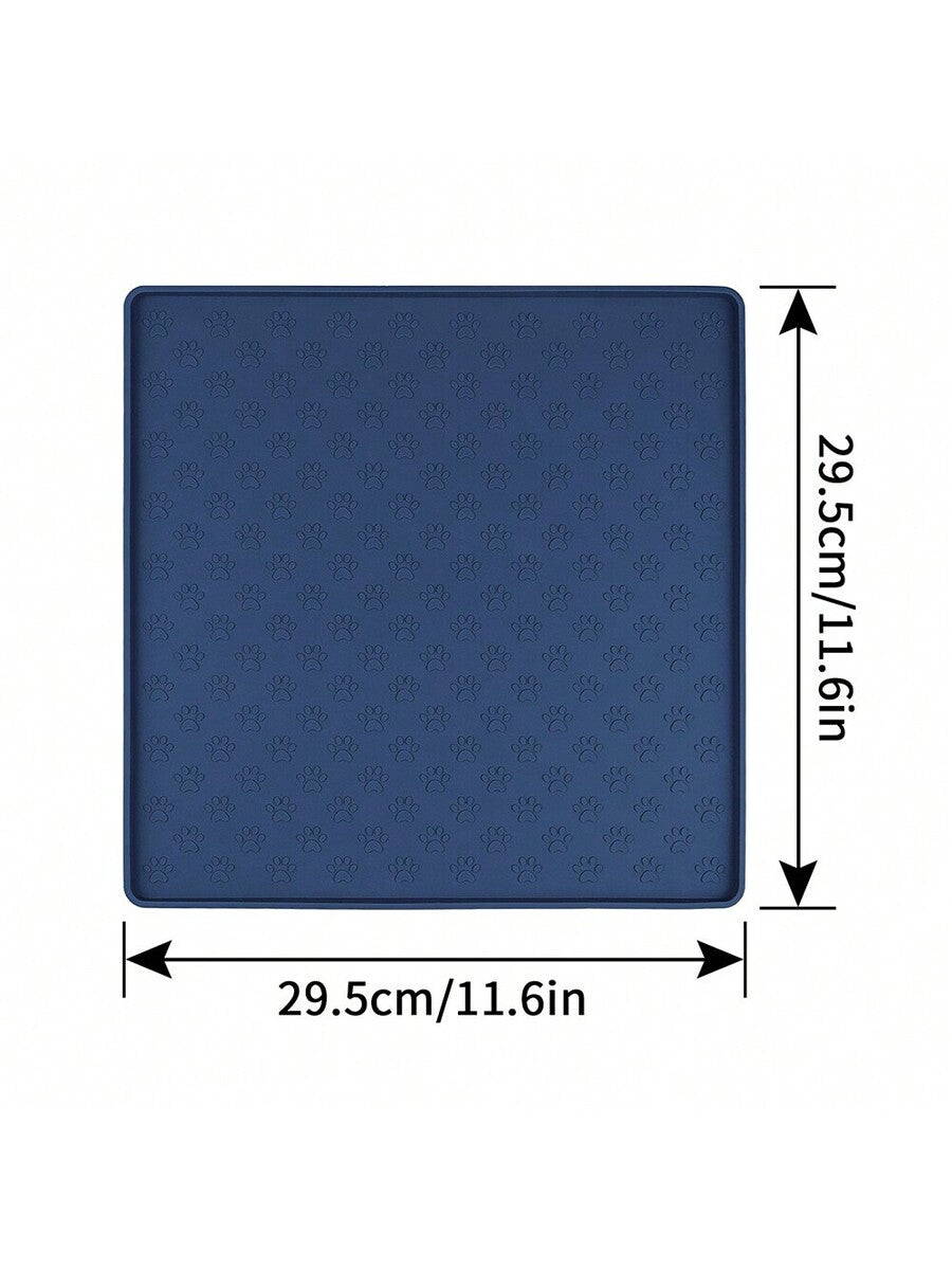Beige silicone pet placemat with embossed paw print accents designed to catch food and water spills for dogs and cats.