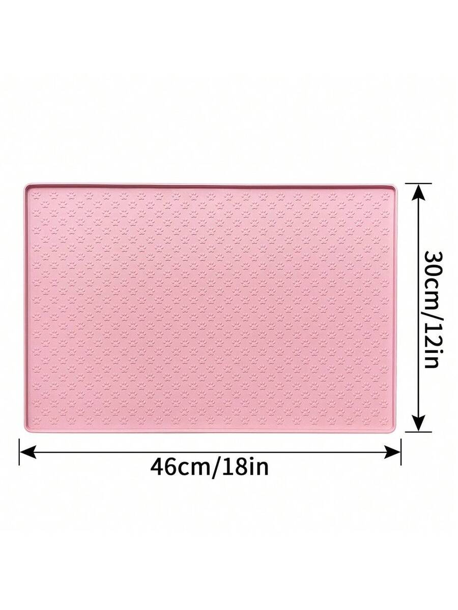 Beige silicone pet placemat with embossed paw print accents designed to catch food and water spills for dogs and cats.