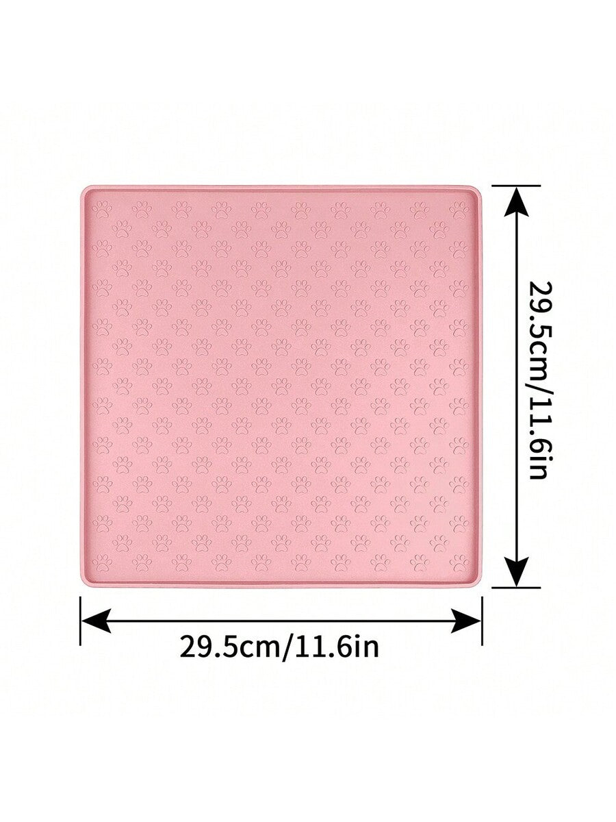 Beige silicone pet placemat with embossed paw print accents designed to catch food and water spills for dogs and cats.