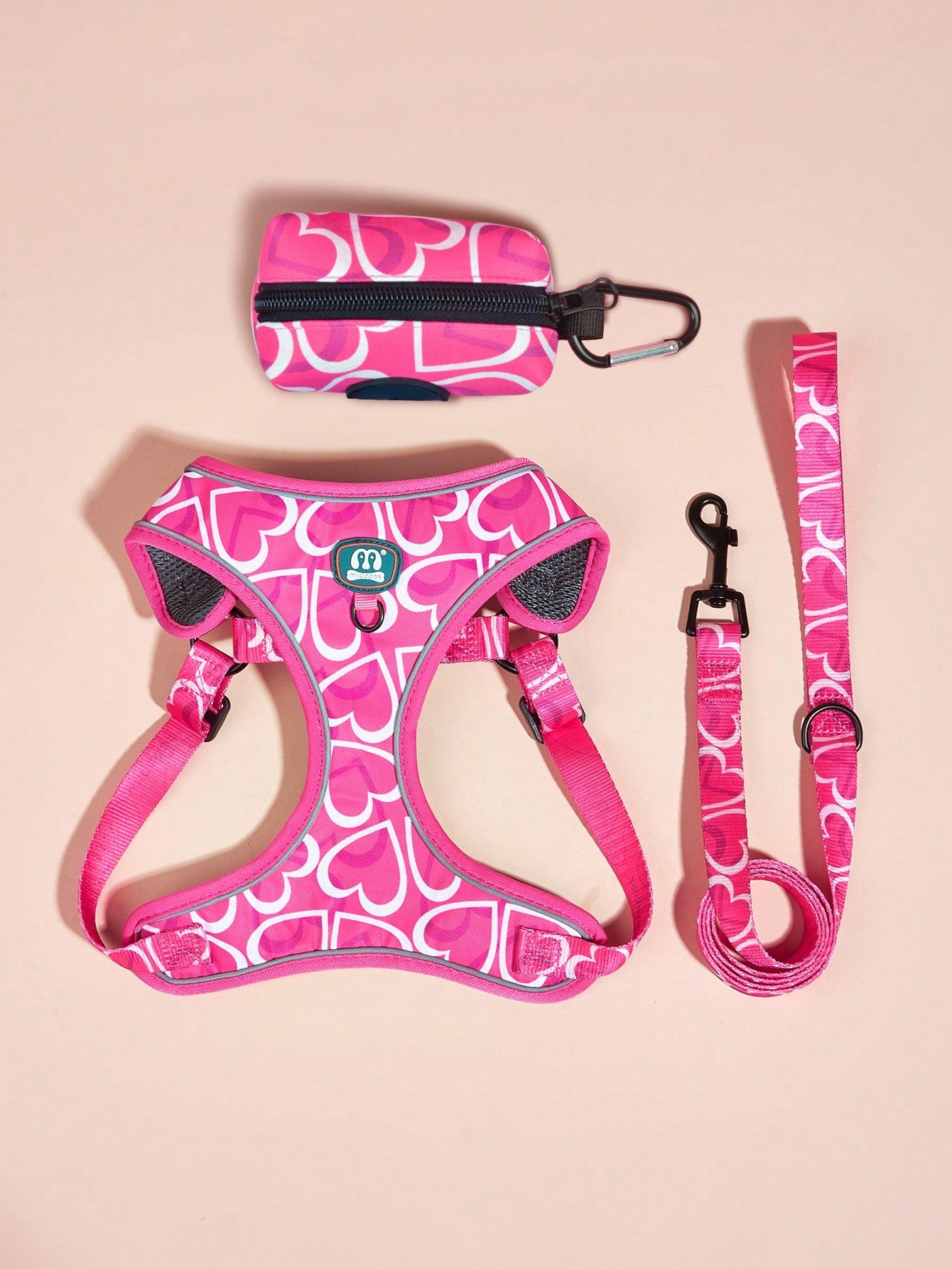 Hot pink heart print adjustable dog harness and leash set with matching poop bag holder for outdoor walking