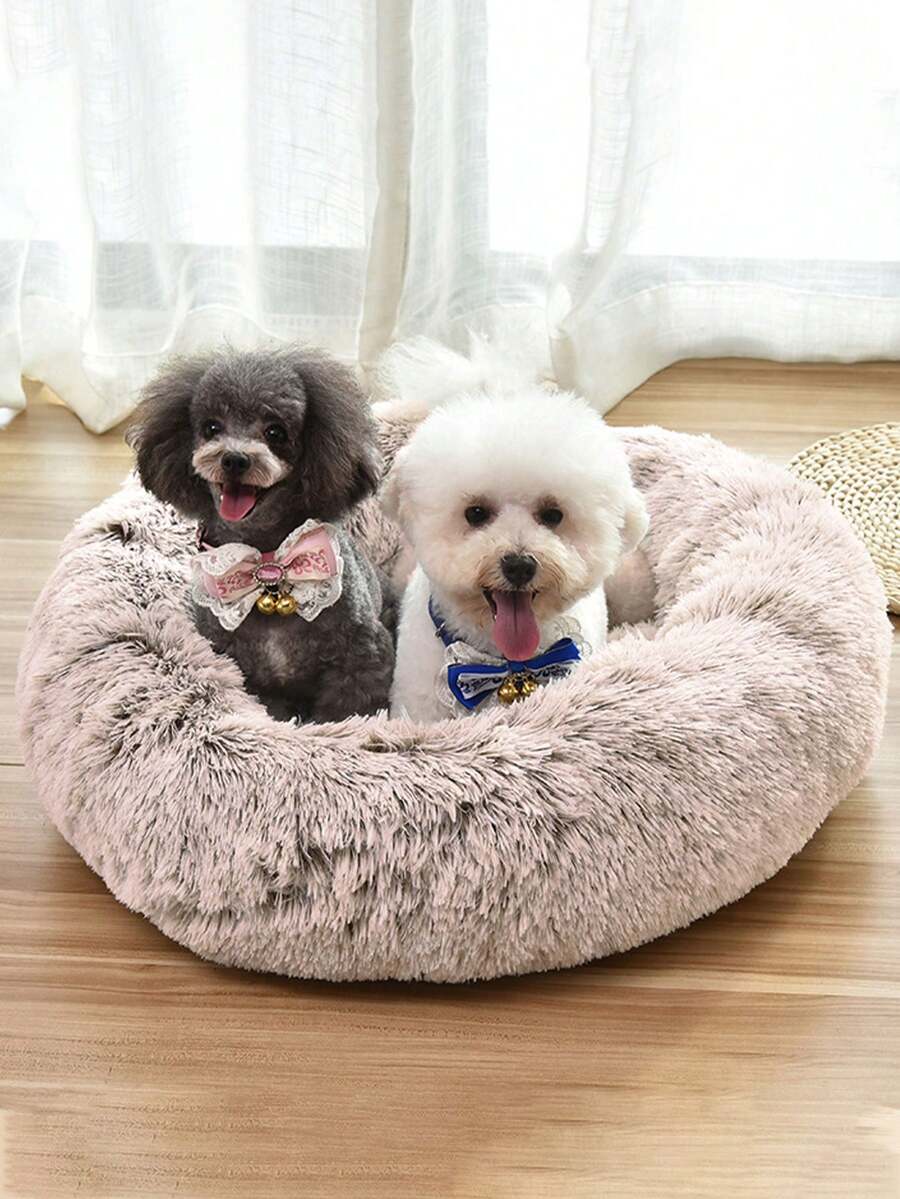 Champagne plush round pet bed for small and medium cats and dogs made from soft polyester material.