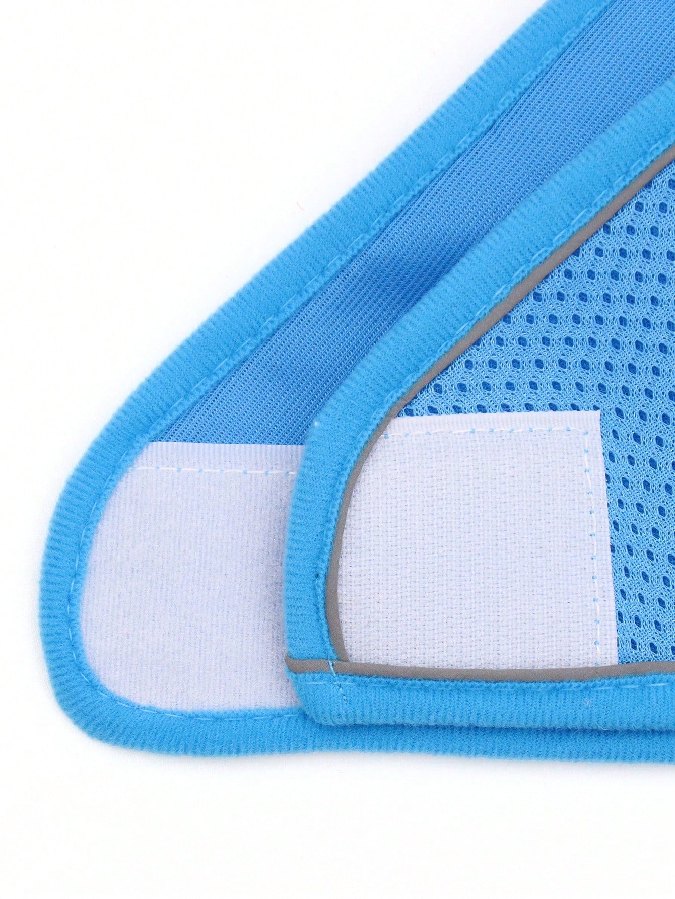 Blue polyester pet chest and back harness with matching leash, breathable mesh fabric, and reflective strips for cats and dogs during outdoor or nighttime walks.