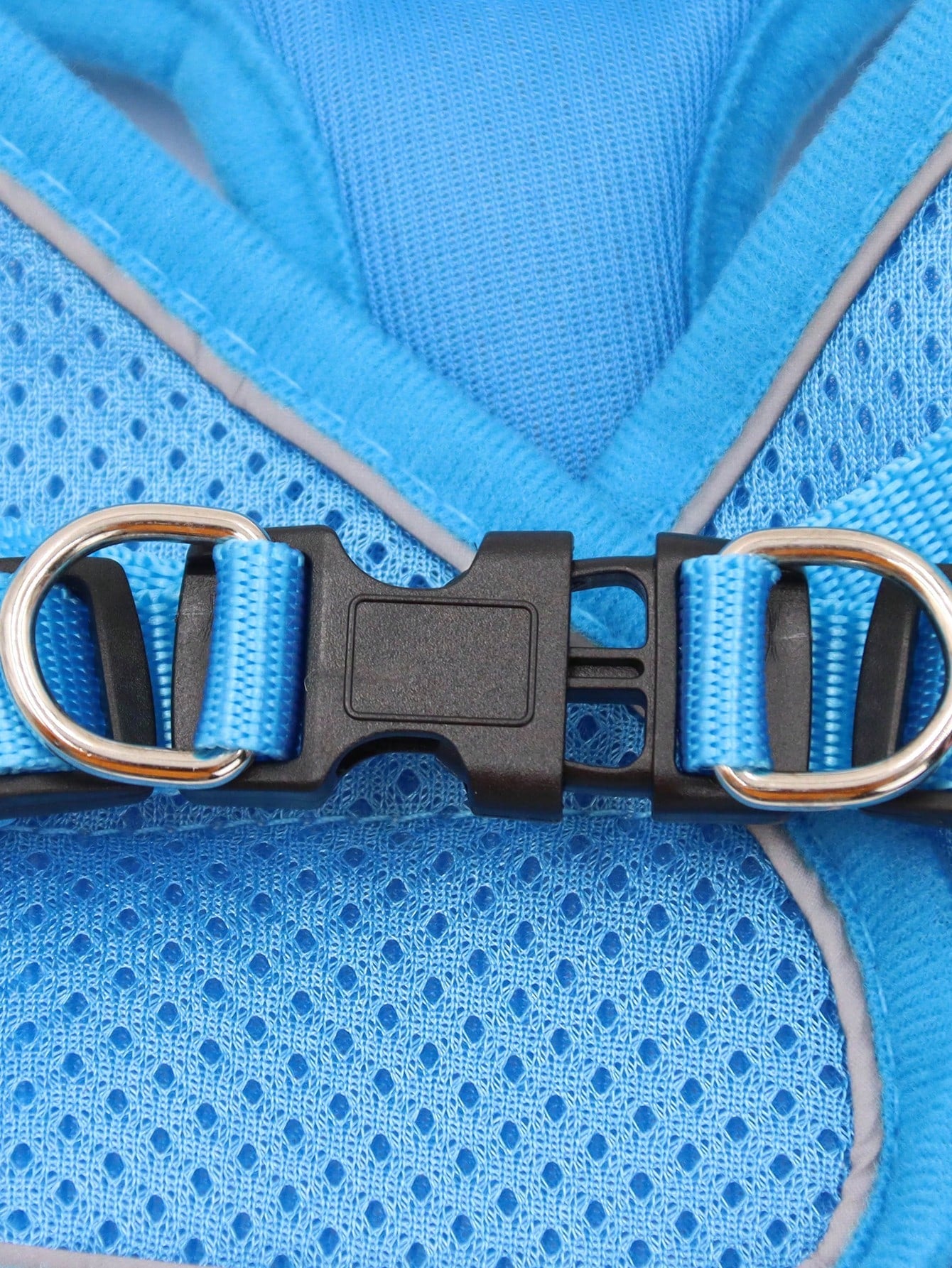 Blue polyester pet chest and back harness with matching leash, breathable mesh fabric, and reflective strips for cats and dogs during outdoor or nighttime walks.