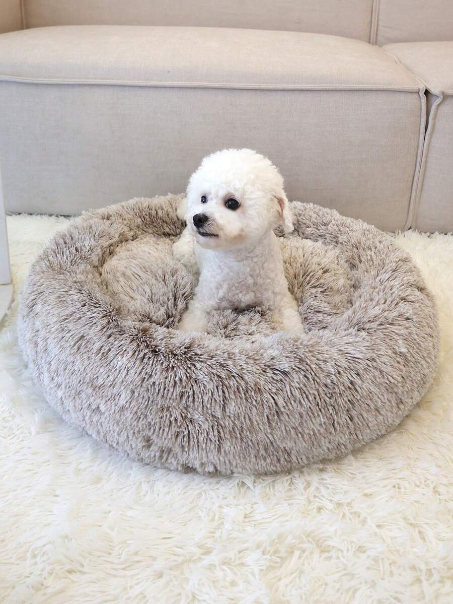 Champagne plush round pet bed for small and medium cats and dogs made from soft polyester material.