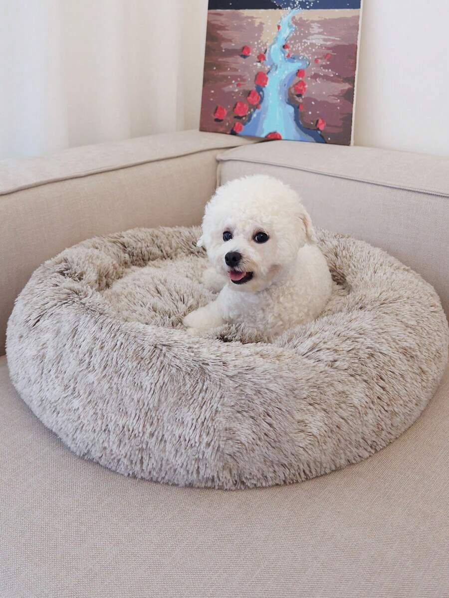 Champagne plush round pet bed for small and medium cats and dogs made from soft polyester material.
