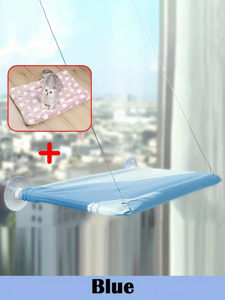 Multicolor hanging cat window hammock bed with cozy blanket mounted on a sunny window seat.
