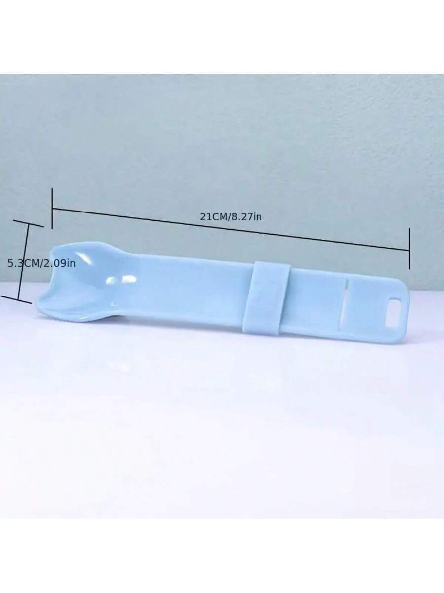 Multicolor cartoon PP cat strip squeeze spoon feeding tool for licking liquid cat treats.