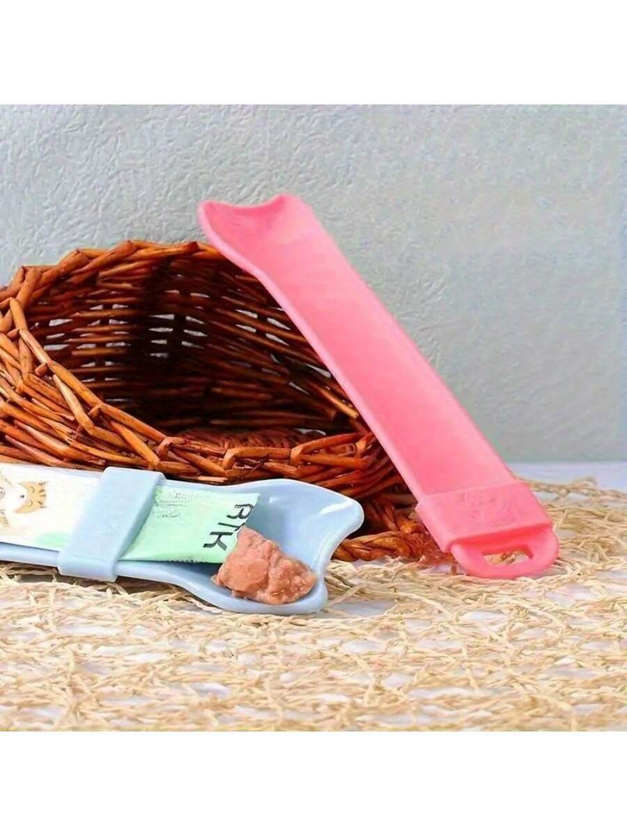 Multicolor cartoon PP cat strip squeeze spoon feeding tool for licking liquid cat treats.