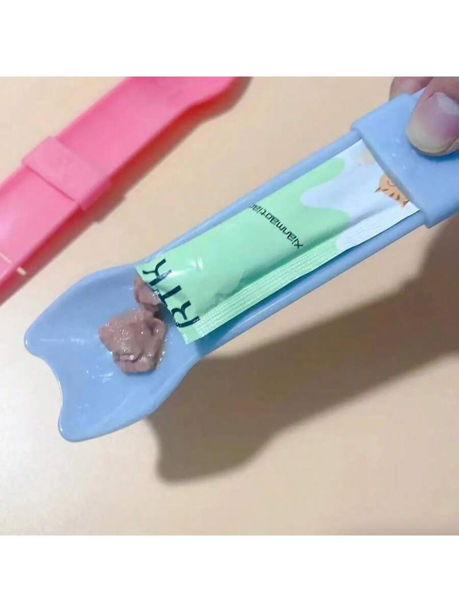 Multicolor cartoon PP cat strip squeeze spoon feeding tool for licking liquid cat treats.