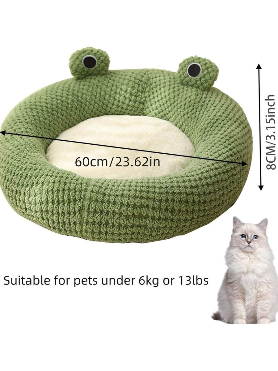 Mint green round plush pet bed featuring an open warm nest design for cats and small dogs.