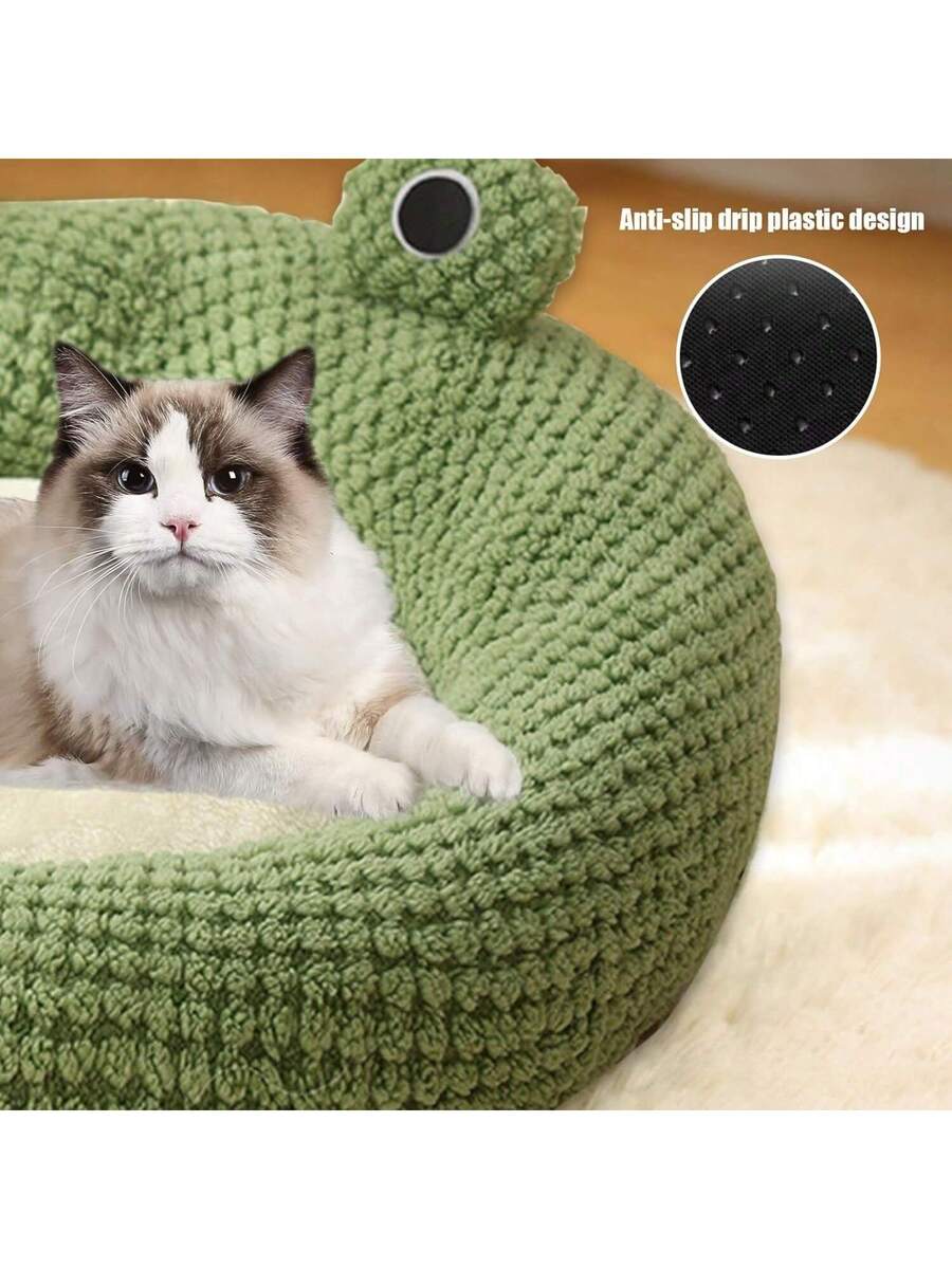 Mint green round plush pet bed featuring an open warm nest design for cats and small dogs.