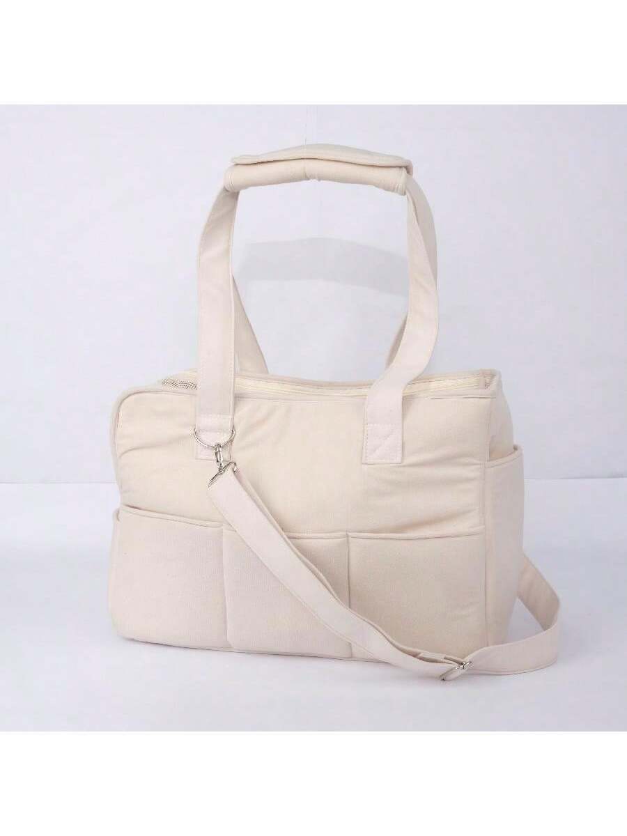 Multicolor breathable pet shoulder carry bag and portable crossbody dog and cat carrier made of 100% polyester.