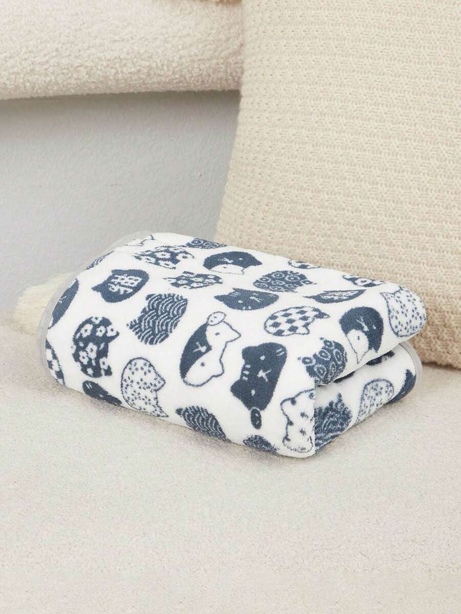 Warm plush pet blanket featuring a multicolor cartoon cat and plant print pattern, made from 100% polyester fabric for cats and dogs.