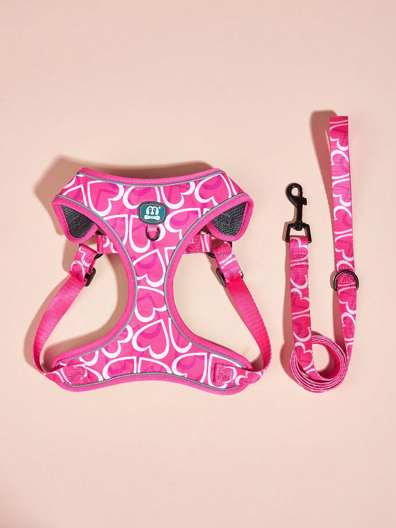 Hot pink heart print adjustable dog harness and leash set with matching poop bag holder for outdoor walking