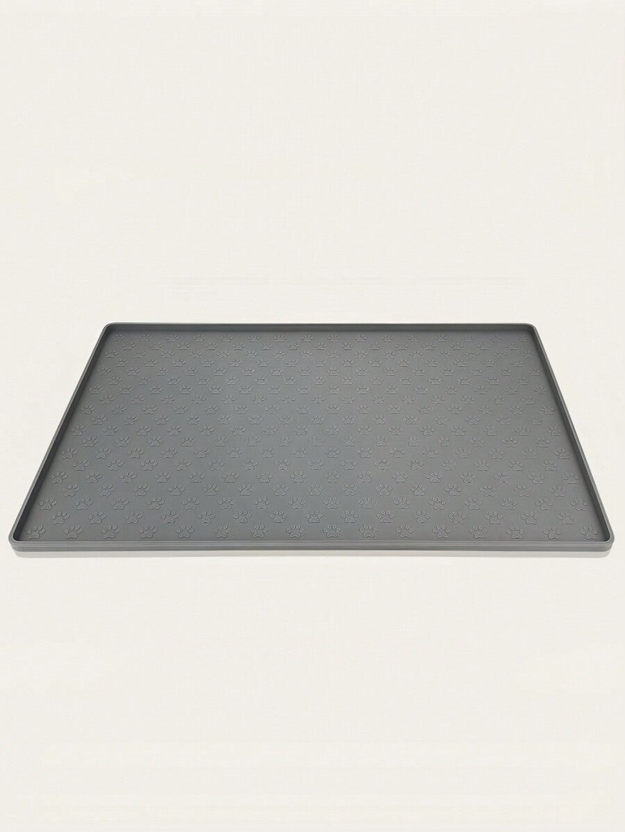 Black and white cartoon diatomite pet feeding mat placed under dog and cat food and water bowls to catch spills.