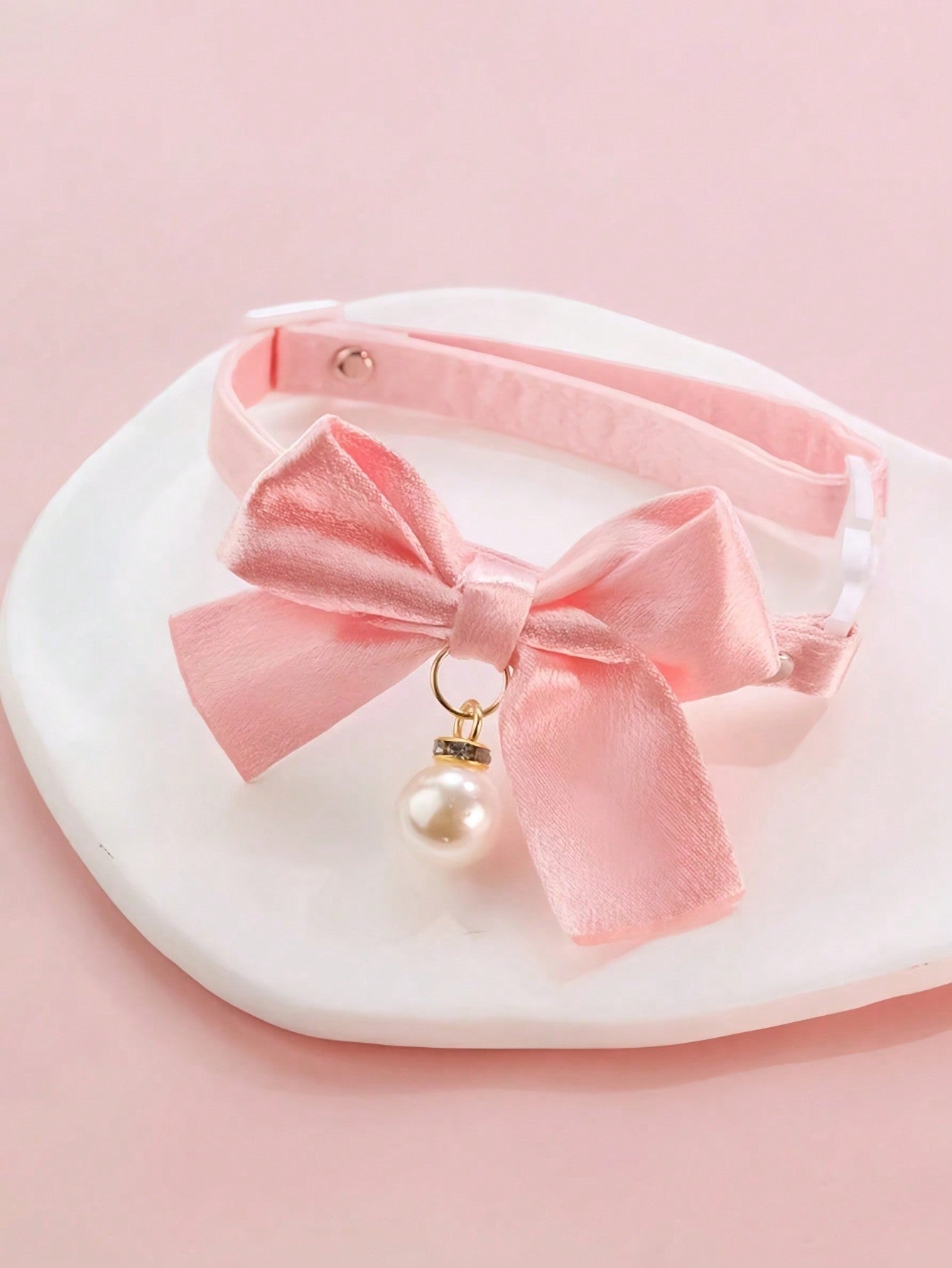 Pink floral breakaway cat collar with bow, pearls, and lace-style details for an adjustable kitten or girl cat collar.