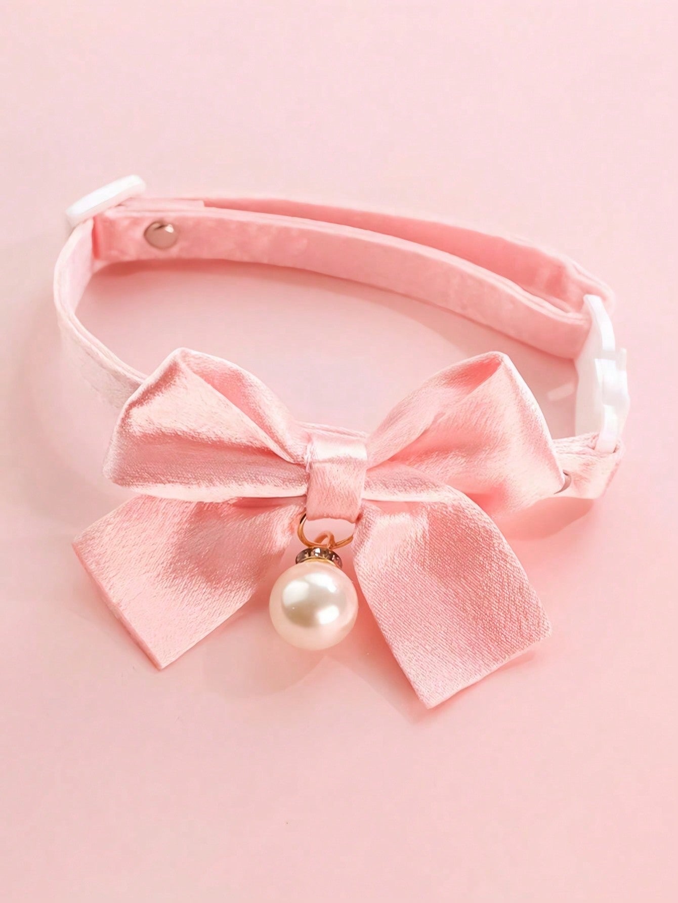 Pink floral breakaway cat collar with bow, pearls, and lace-style details for an adjustable kitten or girl cat collar.