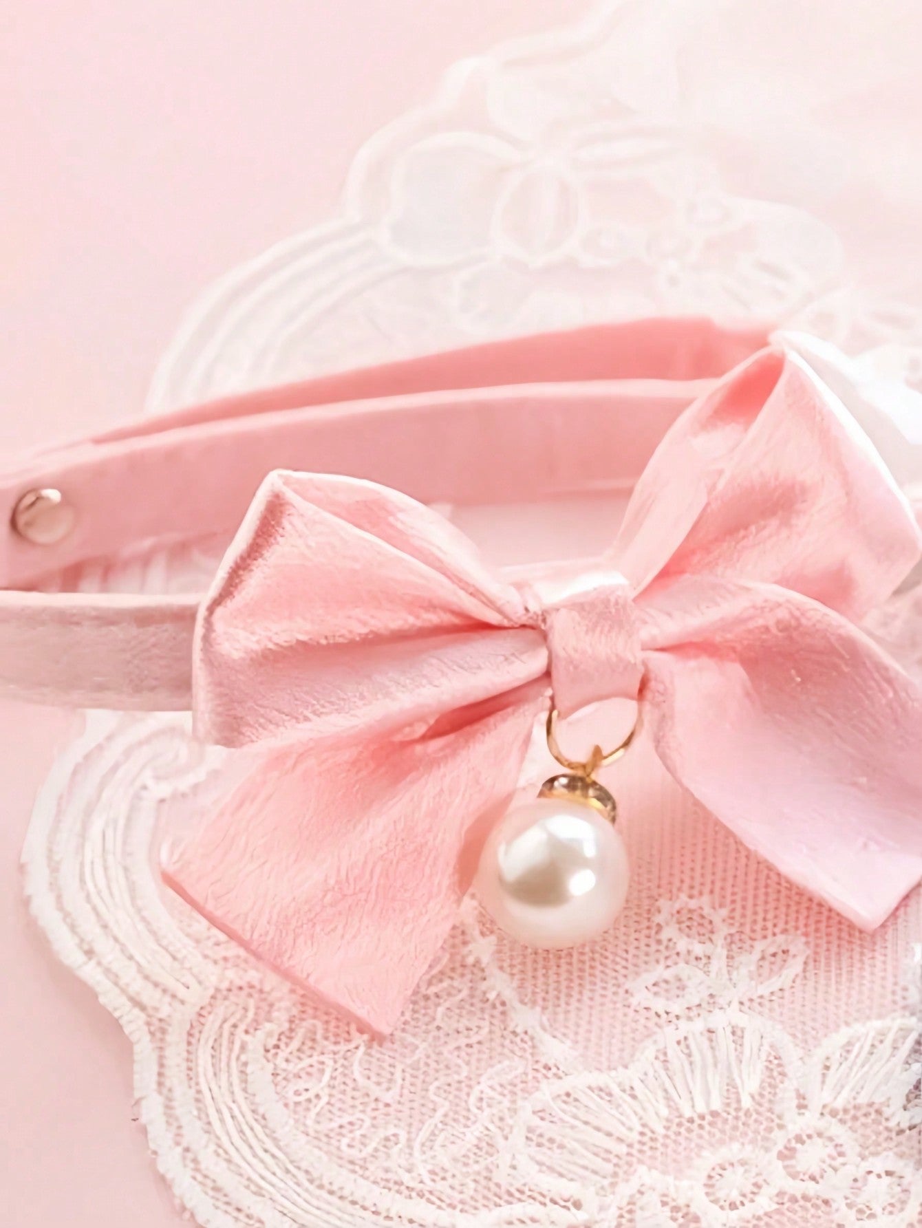 Pink floral breakaway cat collar with bow, pearls, and lace-style details for an adjustable kitten or girl cat collar.