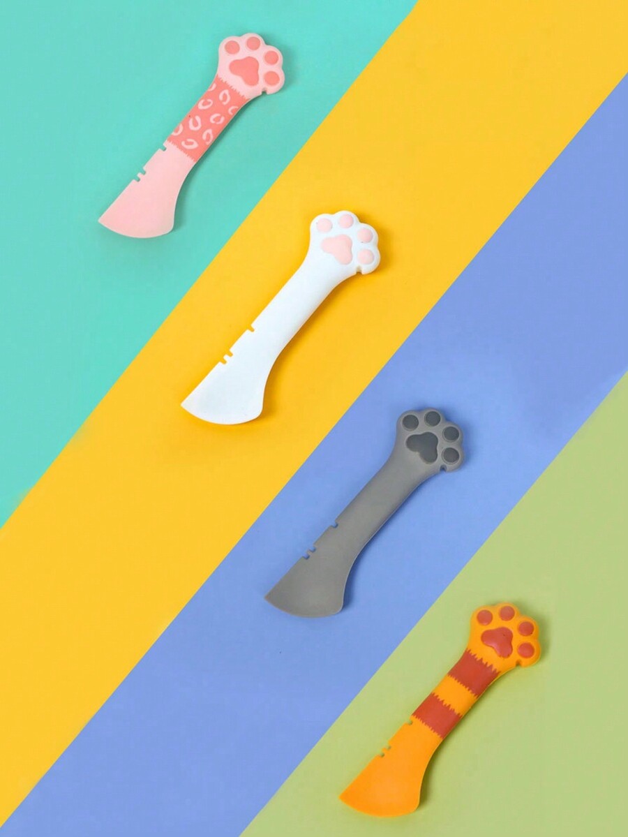 Multicolor cat paw shaped silicone pet can spoon and opener tool for feeding cats, dogs, and small animals.