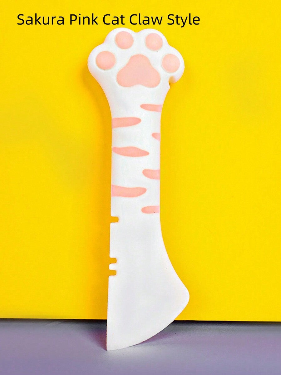 Multicolor cat paw shaped silicone pet can spoon and opener tool for feeding cats, dogs, and small animals.