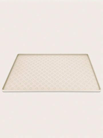 Beige silicone pet placemat with paw detail designed for cat and dog food and water bowls