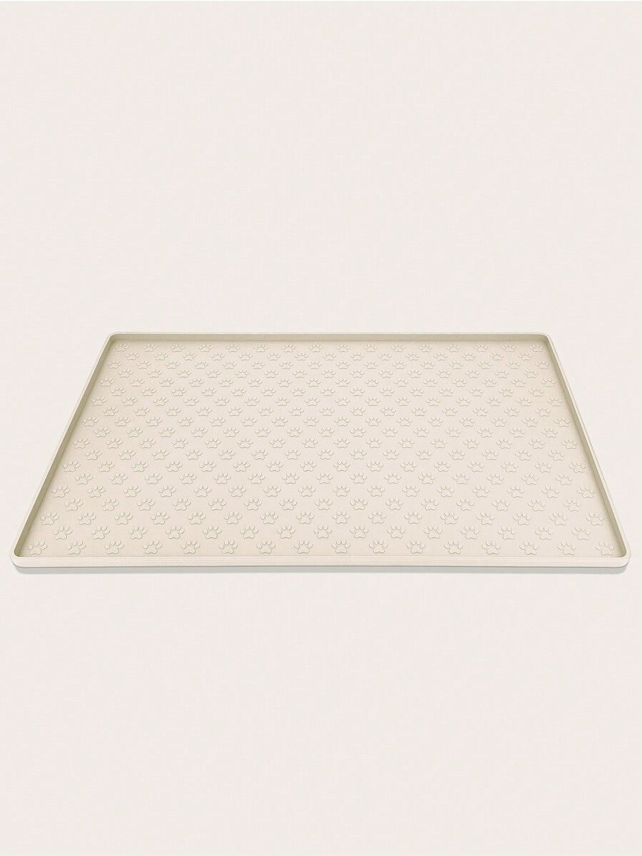 Beige silicone pet placemat with paw detail designed for cat and dog food and water bowls