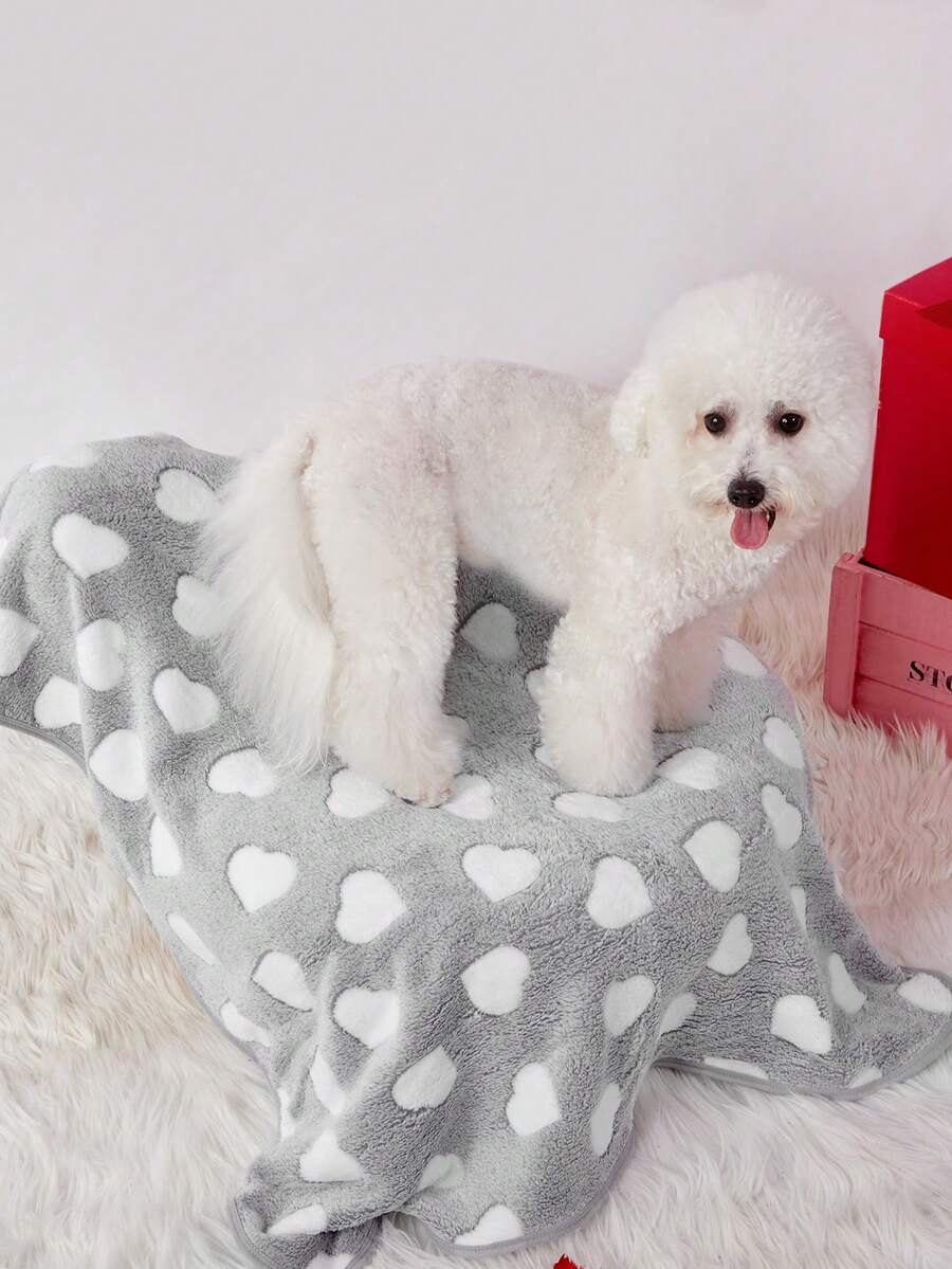 Soft warm pink paw print pattern pet blanket made of 100% polyester for cats and dogs.
