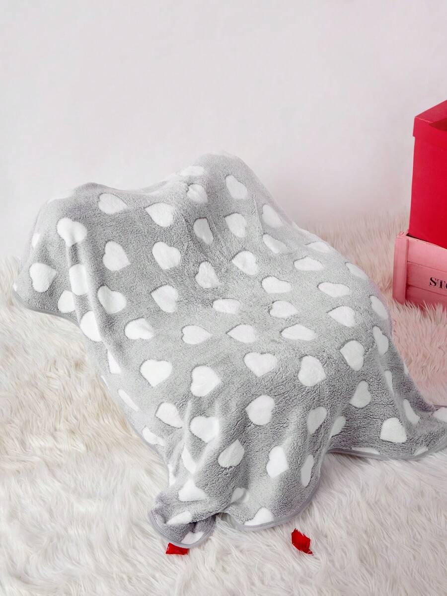 Soft warm pink paw print pattern pet blanket made of 100% polyester for cats and dogs.