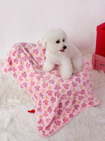 Soft warm pink paw print pattern pet blanket made of 100% polyester for cats and dogs.