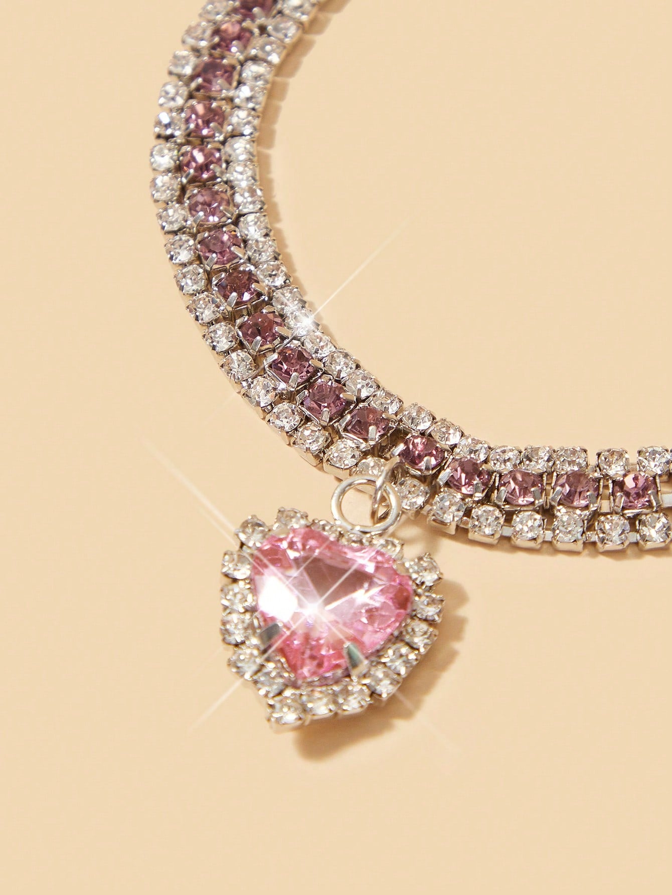 Pink sparkly crystal heart shaped adjustable breakaway collar for cats and small dogs, made from polyester for party dress-up or decorative pet styling.