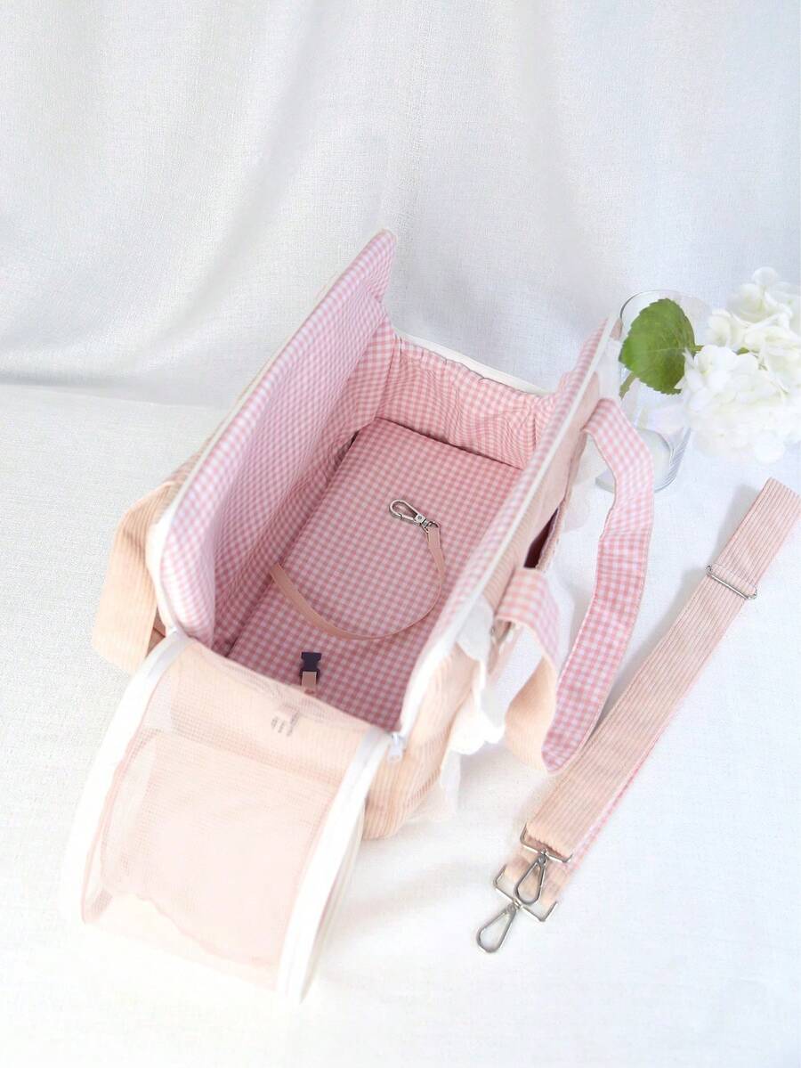 Pink polyester pet carrier bag for small dogs and cats on outdoor outings