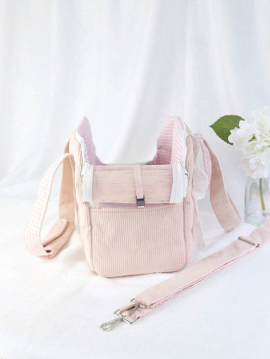 Pink polyester pet carrier bag for small dogs and cats on outdoor outings