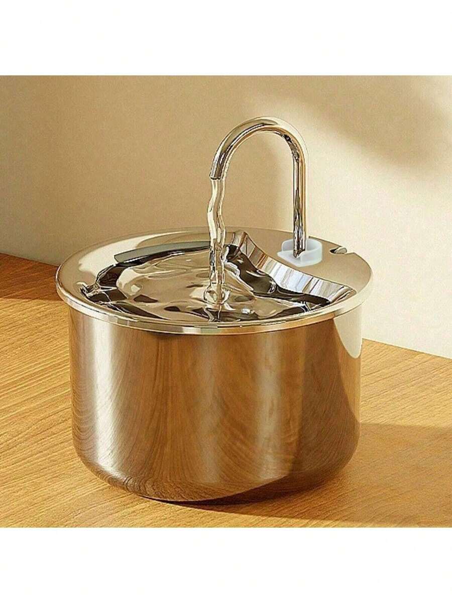 Stainless steel automatic pet water dispenser with USB power cord and splash-proof tray for indoor cats and dogs.