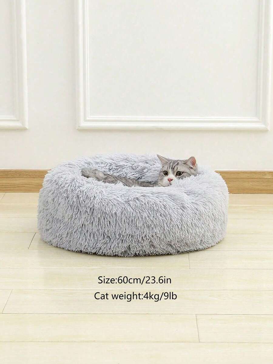 Grey fluffy round pet bed made with 100% polyester fabric and filling for cats and dogs.