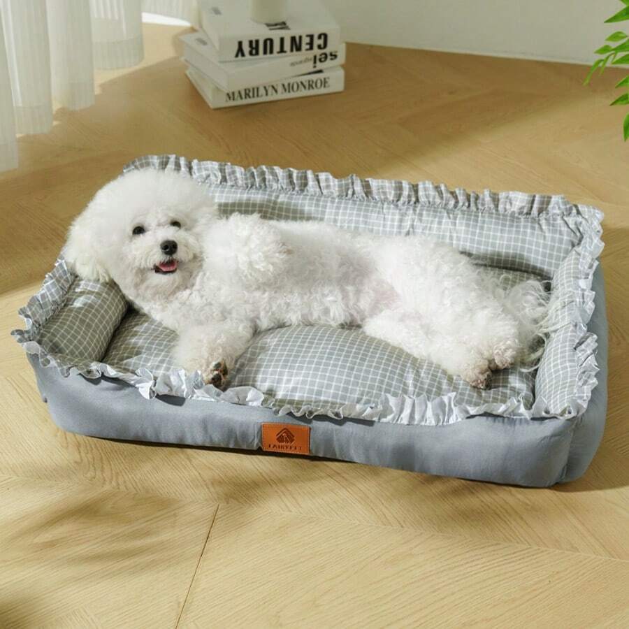Multicolor plaid pet bed for small dogs and cats featuring a soft rolled edge design and polyester filling.