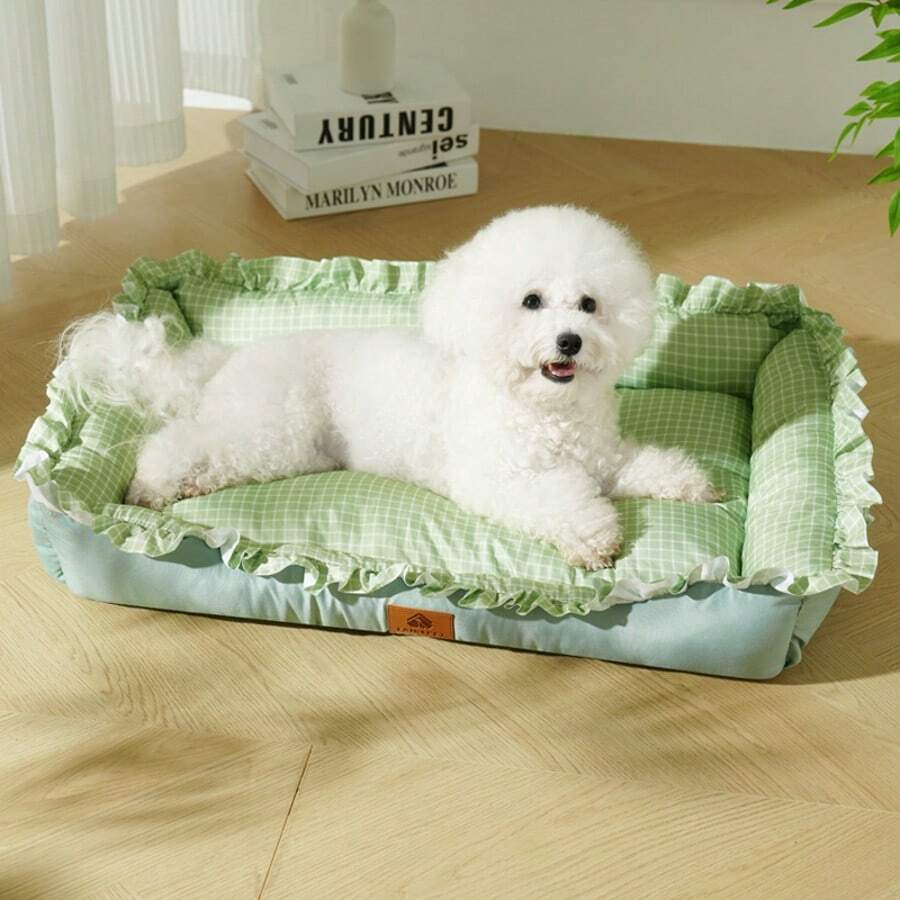 Multicolor plaid pet bed for small dogs and cats featuring a soft rolled edge design and polyester filling.
