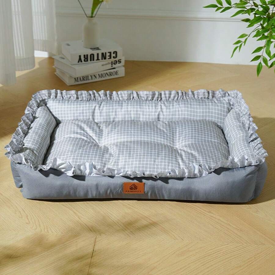 Multicolor plaid pet bed for small dogs and cats featuring a soft rolled edge design and polyester filling.
