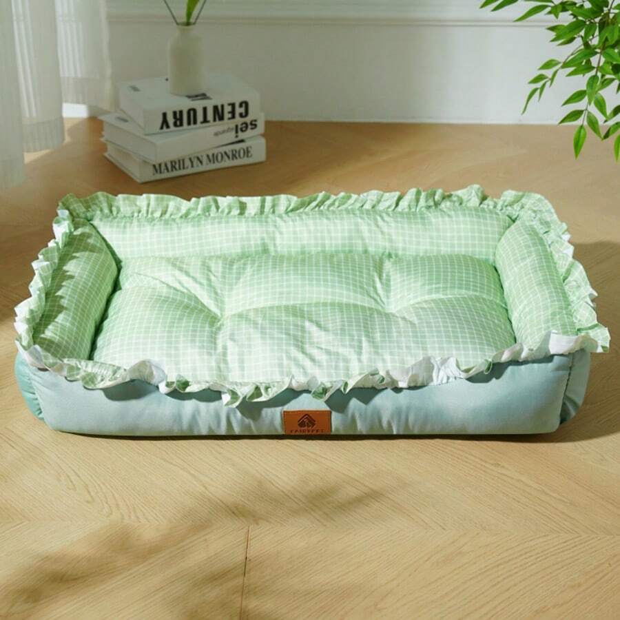 Multicolor plaid pet bed for small dogs and cats featuring a soft rolled edge design and polyester filling.